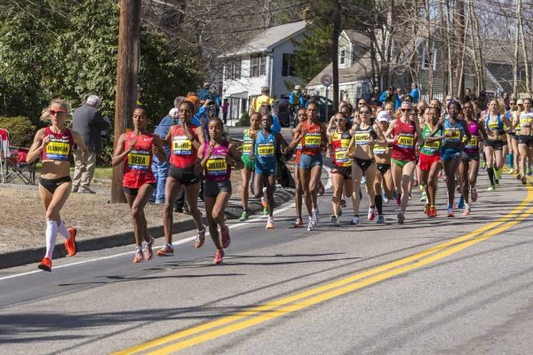 HOPKINTON, USA - APRIL 21: Elite female athletes heading fast and steadily from Hopkinton to Boston in Massachusetts, USA a few minutes after the start of the Boston Marathon 2014 on April 21, 2014.